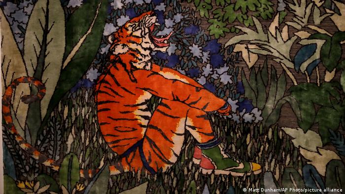 A closeup of a rug that was up for sale at Sotheby's auction house featuring a Bengal tiger 