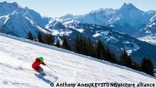 A person skis during a beautiful sunny day at Les Chaux in the Villars-Gryon-Les Diablerets Ski Area, above Gryon in canton Vaud, Switzerland, Tuesday, February 5, 2019. (KEYSTONE/Anthony Anex)