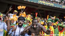 Mali supporters cheer ahead of the Group F Africa Cup of Nations (CAN) 2021 football match between Mali and Mauritania at Stade de Japoma in Douala on January 20, 2022. (Photo by Charly TRIBALLEAU / AFP) (Photo by CHARLY TRIBALLEAU/AFP via Getty Images)
