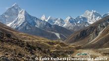 Ama Dablam and other peaks of the Everset Region seen from the trail above Dughla
