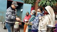 Tite: Parthokor Chowdhury known as hospital man in Kolkata, India Description: A 52 year old pull car driver serves food among the relatives of patients who are admitted in the Govt hospital. He is known as the hospital man. Copyright: Payel Samanta. 