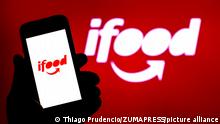 November 8, 2021, Spain: In this photo illustration, an iFood logo seen displayed on a smartphone and in the background. (Credit Image: © Thiago Prudencio/SOPA Images via ZUMA Press Wire