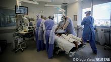 Medical workers take care of a patient at the intensive care unit (ICU) of Hospital das Clinicas amid the outbreak of the coronavirus disease (COVID-19), in Porto Alegre, Brazil January 14, 2022. REUTERS/Diego Vara