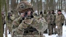 Members of Ukraine's Territorial Defense Forces, volunteer military units of the Armed Forces, train in a city park in Kyiv, Ukraine, Saturday, Jan. 22, 2022. Dozens of civilians have been joining Ukraine's army reserves in recent weeks amid fears about Russian invasion. (AP Photo/Efrem Lukatsky)