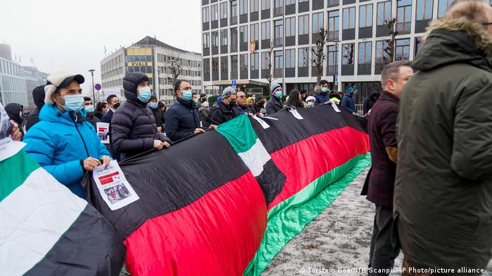 Protesters hold up Afghanistan's flag in Oslo