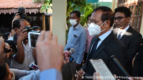 Kem Sokha (R), former leader of the now-dissolved Cambodia National Rescue Party (CNRP), speaks to the media in Phnom Penh