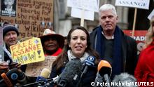 Stella Moris, partner of WikiLeaks founder Julian Assange, speaks next to WikiLeaks Editor in Chief Kristinn Hrafnsson, as supporters protest outside the Royal Courts of Justice in London, Britain, January 24, 2022. REUTERS/Peter Nicholls