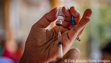 MANILA, PHILIPPINES - JANUARY 19: A healthcare worker prepares a dose of Pfizer BioNTech COVID-19 vaccine, at a zoo converted into a vaccination site on January 19, 2022 in Manila, Philippines. The country is struggling to cope with record numbers of daily cases fueled by the more infectious Omicron variant, recording more than 3 million cases and more than 53,000 deaths with every one in three people tested turning out positive for the coronavirus. (Photo by Ezra Acayan/Getty Images)