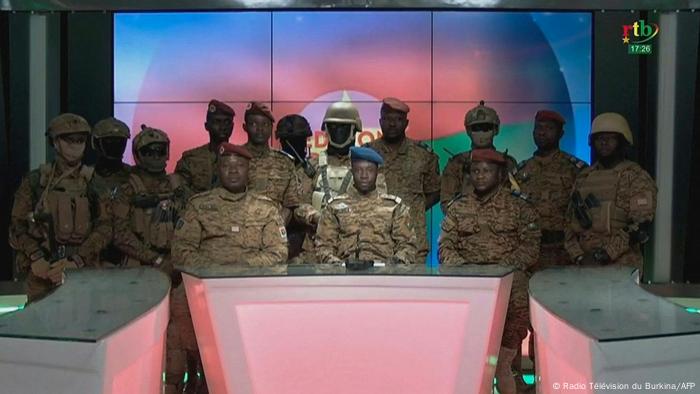 A group of soldiers appearing on state-run TV to announced their seizure of power