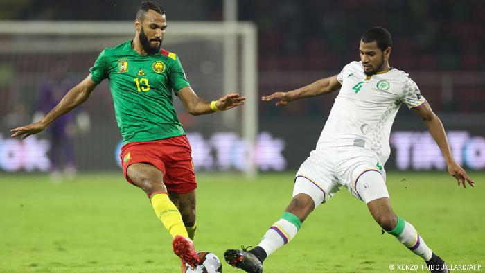Comoros' defender Younn Zahary fights for the ball with Cameroon's forward Eric Choupo Moting