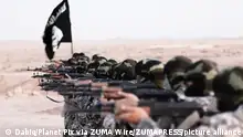 Nov. 19, 2015 - Raqqa, Syria - Islamic State of Iraq and the Levant propaganda photo showing masked militants firing weapons