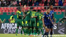 Senegal's Sadio Mane celebrates scoring their first goal with teammates