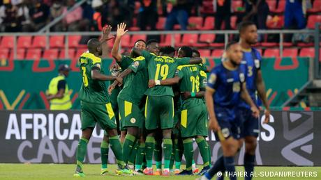 Senegal's Sadio Mane celebrates scoring their first goal with teammates