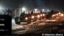 In this photo provided by Vayar Military Agency on Tuesday, Jan. 25, 2022, Belarusian military vehicles gather preparing to attend Belarusian and Russian joint military drills in Belarus. Russia has sent an unspecified number of troops from the country's far east to its ally Belarus, which shares a border with Ukraine, for major war games next month. (Vayar Military Agency Agency via AP)