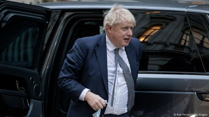 Boris Johnson walking out of a car