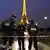Policemen officers stand by the Eiffel Tower, in Paris, Tuesday Sept. 18, 2010. The Eiffel Tower was evacuated after an anonymous caller phoned in a bomb threat from a telephone booth, marking the second alert at the monument in two weeks. (ddp images/AP Photo/Thibault Camus)