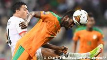 Ivory Coast's midfielder Ibrahim Sangare (R) fights for the ball with Egypt's forward Mostafa Mohamed during the Africa Cup of Nations (CAN) 2021 round of 16 football match between Ivory Coast and Egypt at Stade de Japoma in Douala on January 26, 2022. (Photo by CHARLY TRIBALLEAU / AFP) (Photo by CHARLY TRIBALLEAU/AFP via Getty Images)