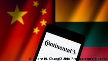 December 17, 2021, Asuncion, Paraguay: Illustration: Logo of Continental is displayed on a smartphone backdropped by cropped waving flags of China and Lithuania. (Credit Image: Â© Andre M. Chang/ZUMA Press Wire