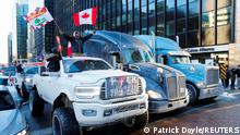 Trucks block a downtown road as truckers and supporters take part in a convoy to protest the coronavirus disease (COVID-19) vaccine mandates for cross-border truck drivers in Ottawa, Ontario, Canada, January 29, 2022. REUTERS/Patrick Doyle