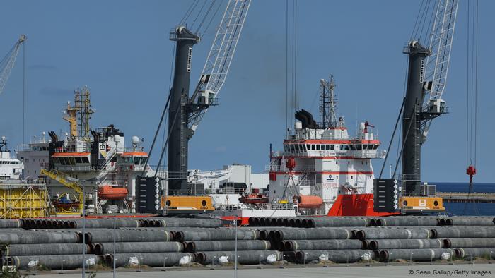 Sections of pipe for the Nord Stream 2 gas pipeline stacked at a port in Sassnitz, Germany