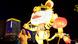 A child laughs next to an illuminated tiger A child laughs next to an illuminated tiger