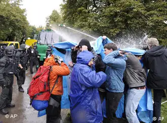Protesters against the Stuttgart 21 project getting sprayed by a water cannon in the Schlossgarten outside the Stuttgart train station