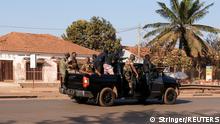Armed soldiers move on the main artery of the capital after heavy gunfire around the presidential palace in Bissau, Guinea Bissau February 1, 2022. REUTERS/Stringer NO RESALES. NO ARCHIVES