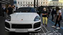 (210909) -- MUNICH, Sept. 9, 2021 (Xinhua) -- A Porsche Cayenne E-Hybrid Coupe is on display at the Porsche outdoor booth during the International Motor Show Germany (IAA Mobility) in Munich, Germany, Sept. 8, 2021. With the slogan What will move us next, IAA Mobility focuses on green mobility, featuring electric cars and even bicycles. (Xinhua/Lu Yang)