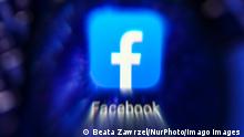 Networking Services Logos Facebook app is seen through a magnifying glass while being displayed on a mobile phone screen for illustration photo. Gliwice, Poland on January 23, 2022. Gliwice Poland PUBLICATIONxNOTxINxFRA Copyright: xBeataxZawrzelx originalFilename: zawrzel-networki220123_npIVG.jpg