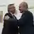  Alberto Fernandez and  Vladimir Putin, two men smiling, embrace
