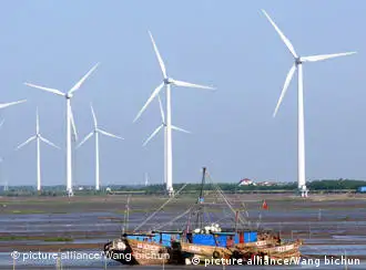 --FILE--View of wind turbines at a wind farm in Rudong, east Chinas Jiangsu province, 29 May 2010. Chinas wind power has expanded rapidly in recent years, almost doubling in size every 12 months since 2005. According to the Global Wind Energy Council, China had wind power capacity of 25.1 gigawatts by the end of 2009. The Clean Development Mechanism (CDM), the worlds leading carbon market and an important tool for the promotion of carbon cuts, climate protection and sustainable development, has played an important role in this growth. As of the end of 2009, 32% of Chinas wind power capacity was registered as CDM projects, with accumulated carbon cuts by 2012 predicted to be 82.5 million tonnes. As a result, Chinas wind power development has been held up as a model of successful CDM application, and these projects have become popular low-risk options in international carbon markets.