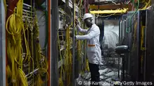 16.05.2018
An employee of French telecoms group Orange Adama Meite is seen during the repair work at an Orange technical centre in Abidjan,on May 16, 2018, two weeks after a fire broke out in this facility, disrupting service for weeks. (Photo by SIA KAMBOU / AFP) (Photo credit should read SIA KAMBOU/AFP via Getty Images)