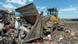 A front-end loader at a rubbish dump A front-end loader at a rubbish dump