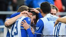 BIELEFELD, GERMANY - FEBRUARY 05: Janni Serra of Arminia Bielefeld celebrates with team mates after scoring their sides first goal during the Bundesliga match between DSC Arminia Bielefeld and Borussia Mönchengladbach at Schueco Arena on February 05, 2022 in Bielefeld, Germany. (Photo by Stuart Franklin/Getty Images)
