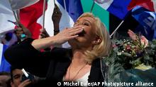 French far-tight leader Marine Le Pen blows a kiss to the audience after her speech during a campaign rally, Saturday, Feb. 5, 2022 in Reims, eastern France. France's dueling far-right presidential candidates Eric Zemmour and Marine Le Pen are holding back-to-back campaign rallies Saturday, trying to steal each other's thunder and keep their anti-immigration, anti-Islam agenda front-and-center in the race for the April presidential election. (AP Photo/Michel Euler)