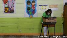 A woman prepares to cast her ballot during the first round of Costa Rica's presidential election at a polling station, in San Cristobal village, in San Jose, Costa Rica, February 6, 2022. REUTERS/Mayela Lopez