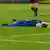 Nicole Billa lies on the turf during a Hoffenheim match