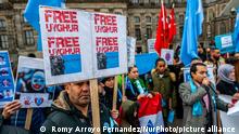A man is holding a placard while another is giving a speech during the demonstration in solidarity with the Uyghurs, started in Amsterdam, on December 29th, 2019. (Photo by Romy Arroyo Fernandez/NurPhoto)
