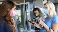 (211007) -- MODIIN, Oct. 7, 2021 (Xinhua) -- A woman shows her COVID-19 Green Pass before entering a restaurant in central Israeli city of Modiin, on Oct. 7, 2021. Israel's Ministry of Health on Thursday reported 2,369 new coronavirus cases, bringing the country's total infections to 1,300,126. (Photo by Gil Cohen Magen/Xinhua)