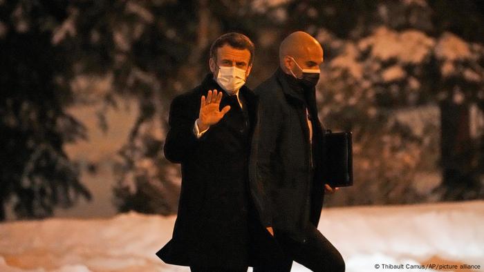 French President Emmanuel Macron, left, arrives at the Kremlin to meet Russian President Vladimir Putin