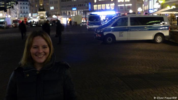 Jessica Rosenthal in Bonn market square, police cars in the background