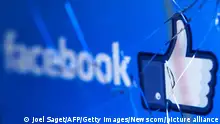 A picture taken in Paris on May 16, 2018 shows the logo of the social network Facebook on a broken screen of a mobile phone. (Joel Saget/AFP/Getty Images) Photo via Newscom picture alliance