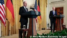 WASHINGTON, DC - FEBRUARY 07: German Chancellor Olaf Scholz (L) delivers remarks alongside U.S. President Joe Biden during a joint news conference in the East Room of the White House on February 07, 2022 in Washington, DC. This marks the first official visit to Washington for Scholz as he is expected to be pressed on Germany's stance on sanctions against Russia should they invade Ukraine. (Photo by Anna Moneymaker/Getty Images)