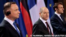 German Chancellor Olaf Scholz, French President Emmanuel Macron and Polish President Andrzej Duda attend a news conference ahead of a Weimar Triangle meeting to discuss the ongoing Ukraine crisis, in Berlin, Germany, February 8, 2022. REUTERS/Hannibal Hanschke/Pool