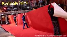 Workers lay the red carpet for the upcoming Berlinale Film Festival in Berlin, Germany, February 8, 2022. REUTERS/Hannibal Hanschke