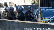 Security forces patrol outside at the Palace of Justice Wednesday, Sept. 8, 2021 in Paris. France is putting on trial 20 men accused in the Islamic State group's 2015 attacks on Paris that left 130 people dead and hundreds injured. The proceedings begin Wednesday in an enormous custom-designed chamber. Most of the defendants face the maximum sentence of life in prison if convicted of complicity in the attacks. Only Abdeslam is charged with murder. (AP Photo/Francois Mori)