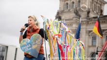 Grandmothers are giving hope to their grandchildren, says Cordula Weimann. Cordula Weimann speaks at a protest in Germany. 