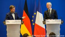 German Economy and Climate Minister Robert Habeck, left, and French Finance Minister Bruno Le Maire participate at a media conference after a meeting in Paris, Monday, Feb. 7, 2022. (AP Photo/Michel Euler)