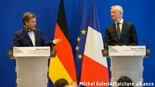 German Economy and Climate Minister Robert Habeck, left, and French Finance Minister Bruno Le Maire participate at a media conference after a meeting in Paris, Monday, Feb. 7, 2022. (AP Photo/Michel Euler)