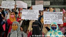 Muslim students display placards during a protest against the recent hijab ban in few colleges of Karnataka state, at Aliah University in Kolkata, India, February 9, 2022. REUTERS/Rupak De Chowdhuri